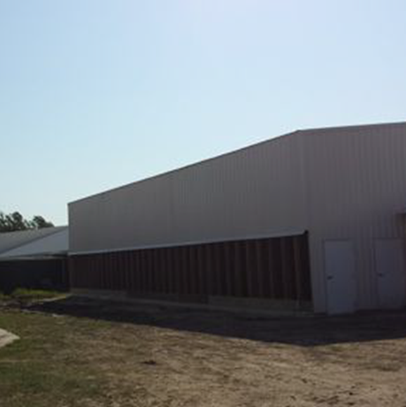 Exterior of an existing barn with a filter wall dormer added along the sidewall